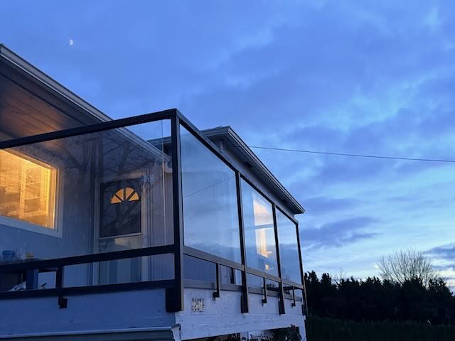 Glass railing system at twilight - Kirkland home